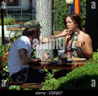 AJ McLean and his 18 year old fiance Kaci Brown enjoy a romantic afternoon in Malibu, Ca. The couple held hands, kissed and fed food to eachother. Stock Photo