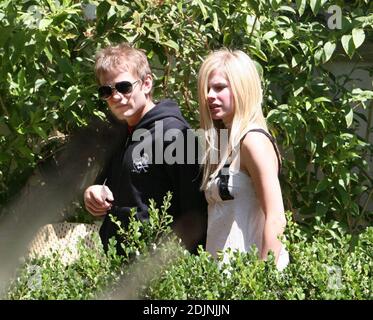 Exclusive!! Avril Lavigne and Deryck Whibley leave a trendy Los Angeles hotel. Avril is not wearing her wedding ring. The woman in the photo could be her mother. 8/4/06 Stock Photo