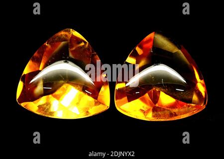 Natural yellow citrine on black background Stock Photo