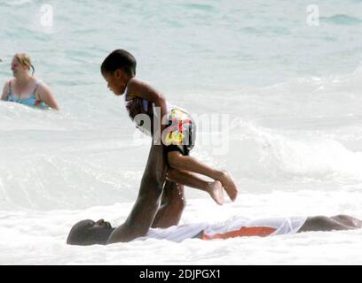 Exclusive!! Shaquille O'Neal spends a day on Miami Beach with wife Shaunie and family. The NBA superstar frolicked with kis kids in the surf and seemed to be having a whale of a time.  Professionally, O'Neal has not only been playing ball, but also the real estate market.  Possessing an impressive real estate portfolio since his rookie days, he recently announced a new firm, The O'Neal Group, which will be involved in a $1 billion project to build 1,100 residential units in a sprawling downtown Miami complex. 9/17/06 Stock Photo