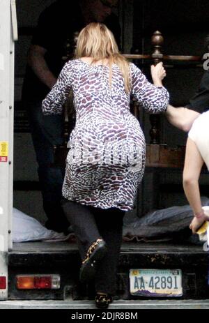 Kirstie Alley flaunts her new figure in a skin tight outfit during a Sunday afternoon shopping trip with her kids William and Lillie. The 'Fat Actress' first lunched at Panera Bread, followed by a sweet treat. Then it was on to an antique store where she helped load up a new wooden table into her rented U-Haul. Maybe Alley was spending some of the cash she earned from the yard sale she held last weekend at her house. Studio City, Ca. 10/1/06 Stock Photo