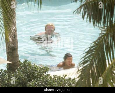 Boris Becker takes a refreshing dip in the pool with girlfriend with Sharlely Kerssenberg.  Miami Beach Fl. 10/10/06 Stock Photo