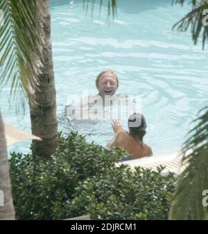 Boris Becker takes a refreshing dip in the pool with girlfriend with Sharlely Kerssenberg.  Miami Beach Fl. 10/10/06 Stock Photo