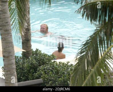 Boris Becker takes a refreshing dip in the pool with girlfriend with Sharlely Kerssenberg.  Miami Beach Fl. 10/10/06 Stock Photo