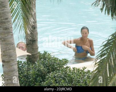 Boris Becker takes a refreshing dip in the pool with girlfriend with Sharlely Kerssenberg.  Miami Beach Fl. 10/10/06 Stock Photo