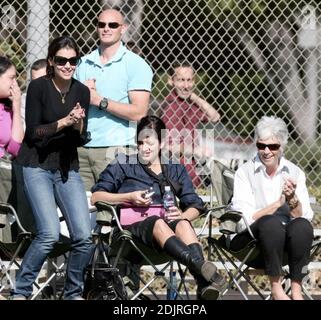 Katie Holmes makes another trip to the ball park, this time with her mother Kathy and one of her sisters. The trim looking actress told photographers she was excited about her upcoming wedding to Tom Cruise. 10/28/06 Stock Photo