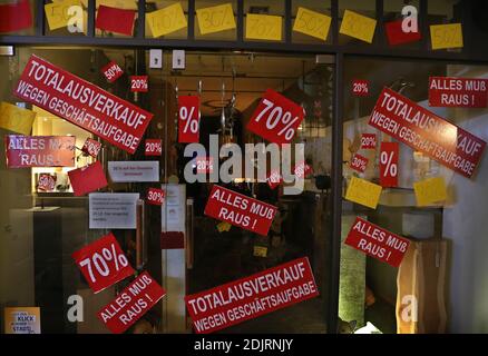 14 December 2020, Bavaria, Würzburg: A shop advertises in the city centre with discounts for discontinued business. Photo: Karl-Josef Hildenbrand/dpa Stock Photo