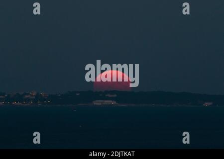 A supermoon rises up from behind the Eden Roc palace hotel in Cap D’Antibes, southern France, on November 14, 2016. The most spectacular supermoon since 1948 lights up the sky on Tuesday morning and evening, appearing 14 per cent bigger and 30 percent brighter than usual. November's supermoon, a term used to describe a full moon is at its perigee or closest point to Earth during the lunar orbit, will be the biggest and brightest supermoon to rise in almost 69 years. A full moon won't come this close to Earth again until November 25, 2034. Photo by Philippe Farjon/ABACAPRESS.COM Stock Photo