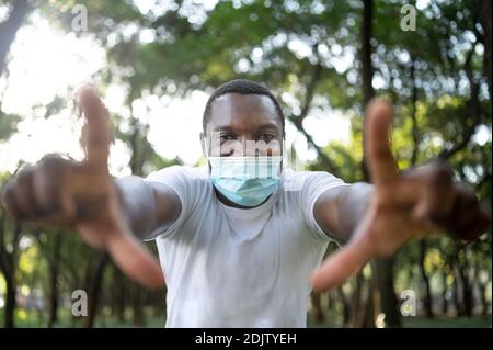 A young black man with a mask in the covid-19 pandemic season. Stock Photo