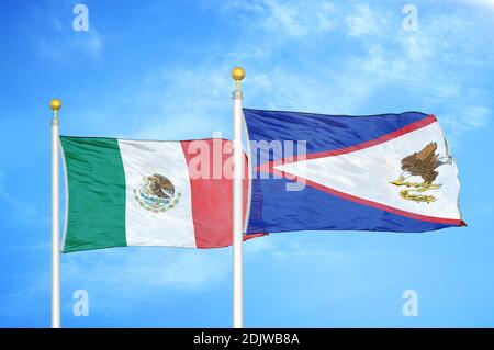 Mexico and American Samoa two flags on flagpoles and blue cloudy sky Stock Photo