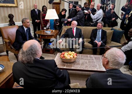 U.S. President Barack Obama, left, speaks as he meets with the 2016 American Nobel Prize laureates including Oliver Hart, professor at Harvard University and winner of the 2016 Sveriges Riksbank Prize in economic sciences in memory of Alfred Nobel, bottom right, F. Duncan Haldane, professor at Princeton University and laureate of the 2016 Nobel Prize in physics, bottom left, J. Fraser Stoddart, professor at Northwestern University and laureate of the 2016 Nobel Prize in chemistry, center, and J. Michael Kosterlitz, professor at Brown University and laureate of the 2016 Nobel Prize in physics, Stock Photo