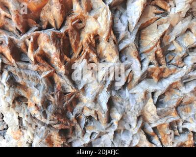 Orange and gray rock texture. Edgy and solid stone surface. Abstract background for text and design copy Stock Photo