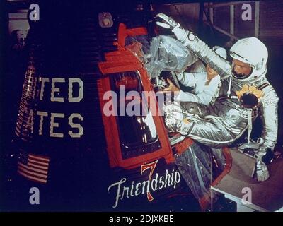 Cape Canaveral, FL - (FILE) -- On February 20, 1962 at 9:47 am EST, John H. Glenn launched from Cape Canaveral's Launch Complex 14 at Cape Canaveral, Florida to become the first American to orbit the Earth. In this image, Glenn enters his Friendship 7 capsule with assistance from technicians to begin his historic flight. Glenn rejoined NASA in 1998 as a member of the STS-95 Discovery crew. This 9-day mission, from Oct. 29-Nov. 7, supported a variety of research payloads including deployment of the Hubble Space Telescope Orbital Systems Test Platform and investigations on space flight and the a Stock Photo