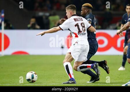 PSG's Serge Aurier battling Nice's Remi Walter during the Ligue 1 soccer match, PSG vs Nice in Parc des Princes, France, on December 11th, 2016. PSG and Nice drew 2-2. Photo by Henri Szwarc/ABACAPRESS.COM Stock Photo