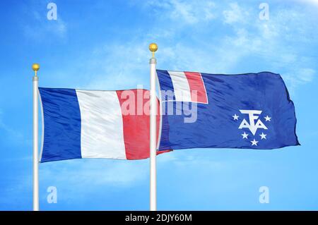 France and French Southern and Antarctic Lands two flags on flagpoles Stock Photo