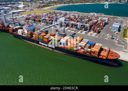 Aerial close-up photo of cargo ships at dock Stock Photo