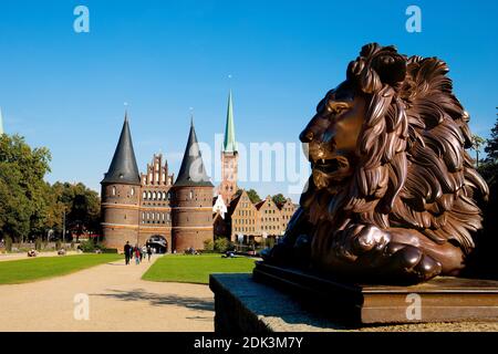 Germany, Schleswig-Holstein, Hanseatic City of Lübeck, Holsten Gate with new gardens, In the background the old salt store and the tower of St, Petri Church, Stock Photo