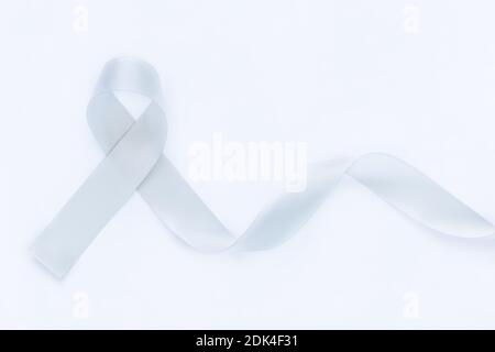 Gray ribbon on white isolated background copy space. Brain Cancer Awareness, Brain Tumors, Allergies, Asthma, Diabetes Awareness, Aphasia disease, Men