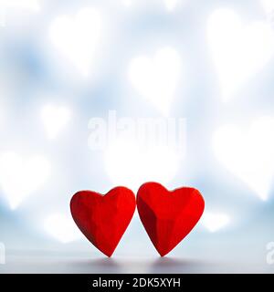 Two red small wooden hearts as symbol of love on Valentine's Day Stock Photo