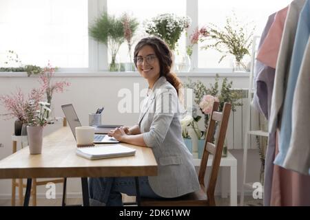 Portrait of happy self employed businesswoman successful at creative profession Stock Photo