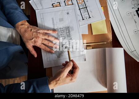 Office employee working with some paperwork at his desk Stock Photo
