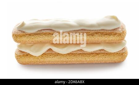 Ladyfinger cookies with cream, process of making tiramisu dessert isolated on white background Stock Photo