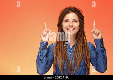 Portrait of happy young woman who has good idea Stock Photo