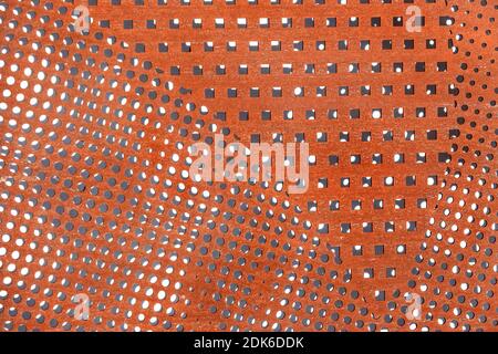 perforated metal rusty surface background Stock Photo