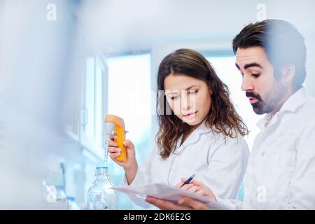 Scientists working in laboratory Stock Photo