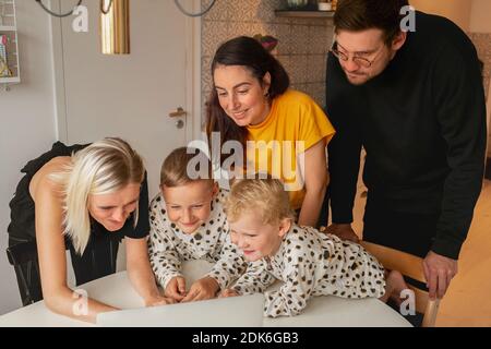 Family with kids using laptop Stock Photo