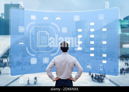 Document Management System (DMS) used to archive, search and manage corporate files and information in enterprise along business processes. Concept wi Stock Photo