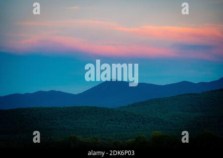 SARANAC LAKE, UNITED STATES - Sep 06, 2020: The sun sets over the Adirondack Mountains near Saranac Lake, New York Stock Photo