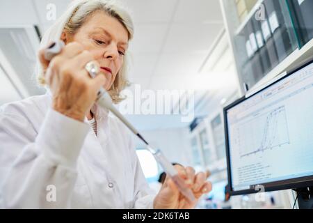 Woman working in laboratory Stock Photo