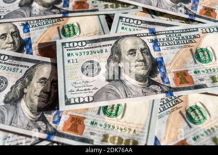 Official currency of the US. Dollar, abbreviation USD. Set of one hundred dollar bills close up. American money. Stock Photo