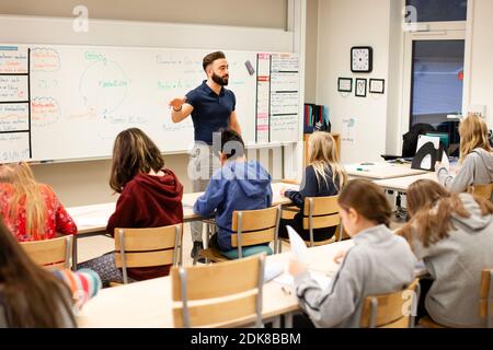 Teacher in front of class Stock Photo