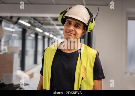 Portrait of worker wearing hardhat Stock Photo