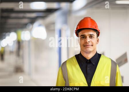 Portrait of worker wearing hardhat Stock Photo