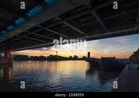 Wien, Vienna, river Donau (Danube), bridge Nordbahnbrücke, Donauturm (Danube Tower), DC Tower 1, Donaucity, cargo ship in 20. Brigittenau, Wien, Austria Stock Photo