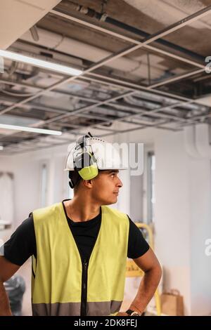 Construction worker wearing hardhat Stock Photo