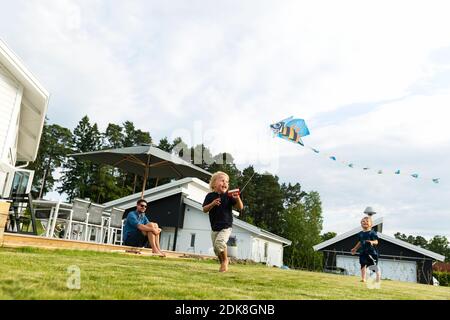 Children flying kite Stock Photo
