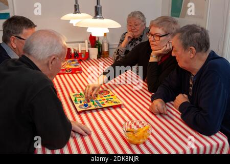 Senior people playing board game Stock Photo