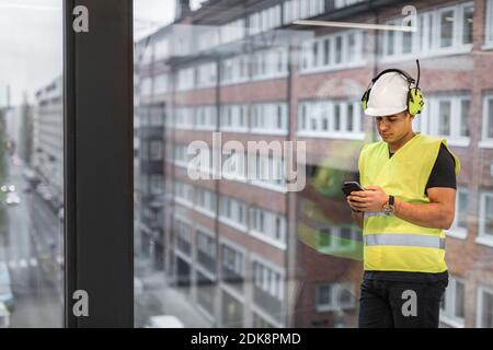 Worker using cell phone Stock Photo