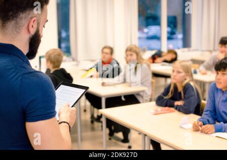 Teacher in front of class Stock Photo