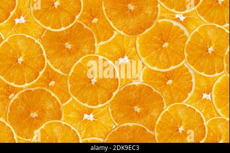 Orange slices seamless background. Cut yellow citrus fruit. Summer design. Stock Photo