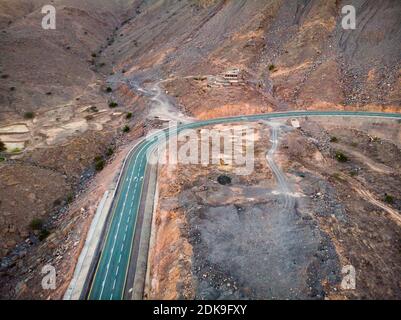 Jebel Jais mountain desert road surrounded by sandstones in Ras al Khaimah emirate of the United Arab Emirates aerial view Stock Photo