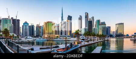 Dubai, United Arab Emirates - November 19, 2020: Panoramic view at Dubai skyline view from the Marasi marina waterfront in the Bur Dubai downtown area Stock Photo