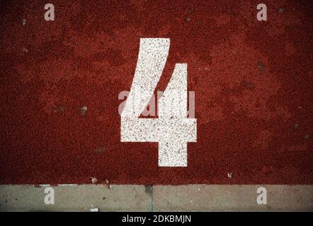 Closeup view of number on athlete path. Stock Photo
