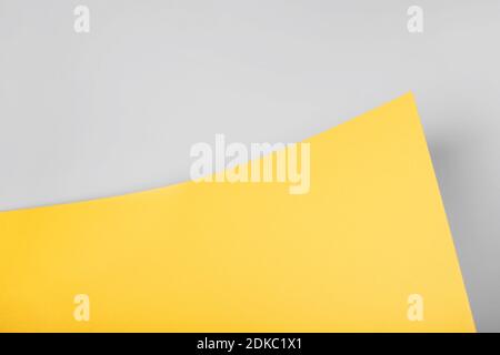 Yellow and gray abstract paper background from a curved sheet. Blank for website, advertising, presentation. Stock Photo