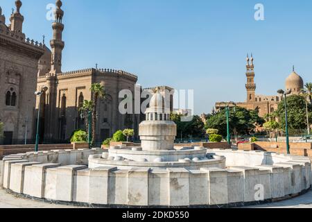 Fountain and Salah El-Deen square and and background of Qanibay al-Rahman Mosque, Mosque of Madrassa of Sultan Hassan and the Mosque of Al Rifai Stock Photo