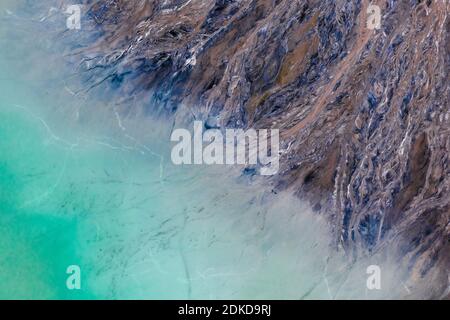 Aerial view of the famous red mud disaster site, abstract lines, turquoise water, surreal landscape, icelandic feeling. Stock Photo